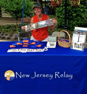 Lori Timney working at NJ Relay booth in 2013.